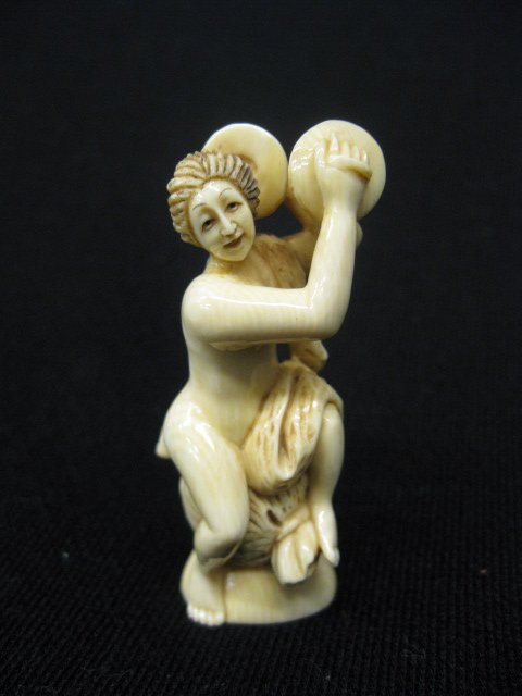Carved Ivory Netsuke of Seated Nude: with cymbals, signed, 2 1/4".