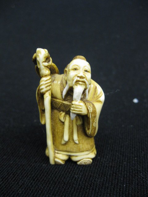 Carved Ivory Netsuke of an Old Man: with staff, 2".