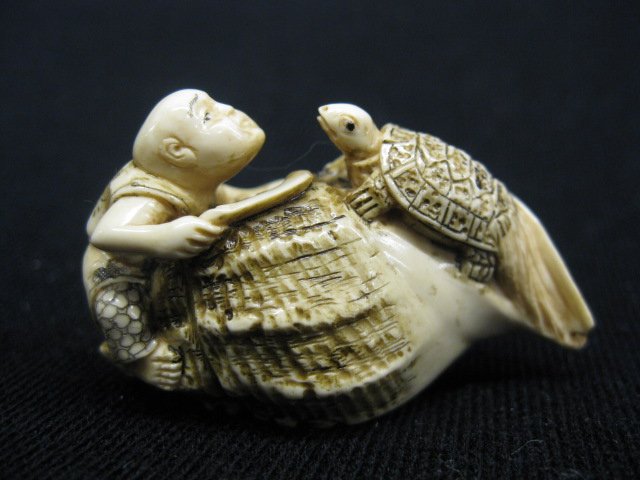 Carved Ivory Netsuke of Man & Turtle: climbing on a giant shell, 1 1/4", signed.