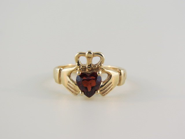 Garnet Irish Claddah Ring,: wedding ring, 1 carat heart shape gem, 14k yellow gold.....The Claddagh ring (Irish: fáinne Chladaigh) is a traditional Irish ring given as a token of friendship, love, as an engagement ring and as a