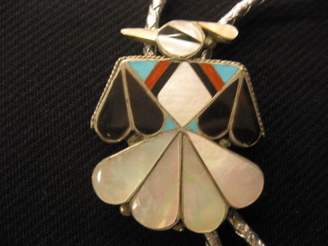 Indian Bolo Tie,: figural thunderbird design with abalone, tortoise shell, coral & turquoise in sterling, 2" x 1 1/2".