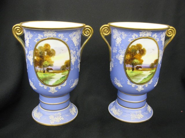 Pair of Nippon handpainted Porcelain Vases,: Wedgwood style blue decoration with oval medallions of landscapes, pedestal bases, hnalded, gold trim, signed, 7 3/4", excellent.