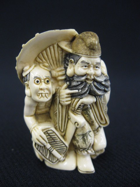 Carved Ivory Netsuke of a Man & Oni,: fancy polychrome, signed, 2".