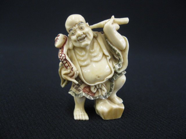 Carved Ivory Netsuke of Lohan,: cleaning his ear and holding a Jui scepter, fine polychrome work, signed, 2".