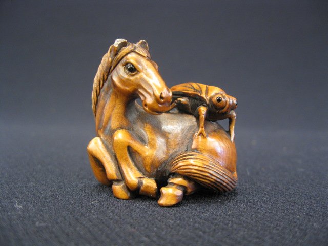 Carved Boxwood Netsuke of a Horse,: grasshopper on his back, signed, 1 1/4".