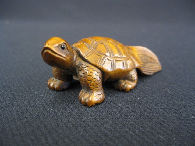 Carved Boxwood Netsuke of a Turtle,: over sized tail, 2 1/2" long, signed.