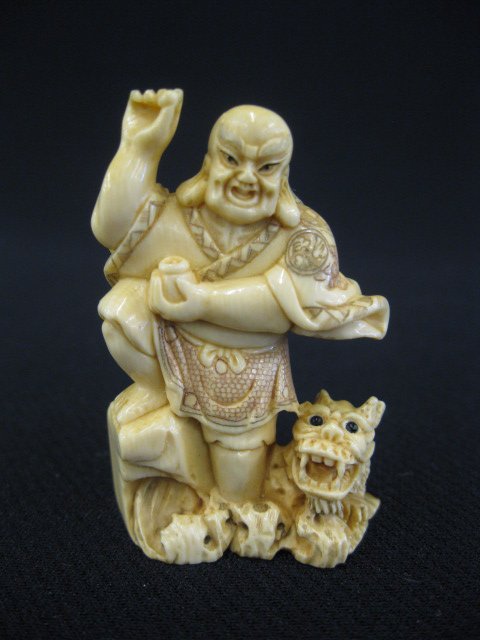 Carved Ivory Netsuke,: immortal & foo dog, signed, 2".