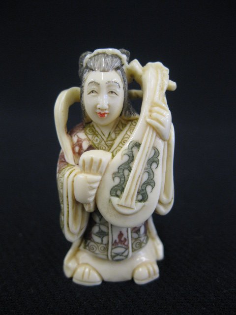 Carved Ivory Netsuke of Benten,: goddess of music and one of the seven gods of good fortune, holding a musical instrument, beautiful polychrome work, signed, 2".