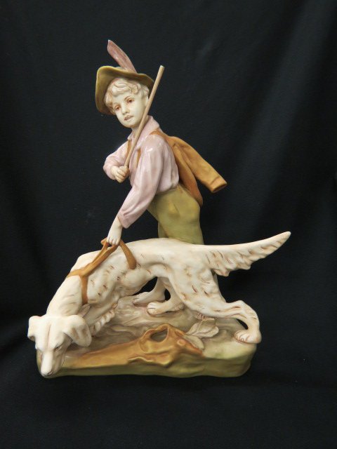 Royal Dux Porcelain Figurine of Boy: with hunting dog, satin finish, 12" x 14", excellent....Royal Dux Porcelain has been produced since 1853, in the small town of Duchcov, located about two hours to the North West of Prague, the capital