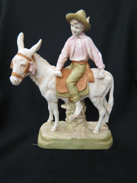 Royal Dux Porcelain Figurine of Boy on Mule,: satin finish, 14 1/2" tall., signed, excellent..Royal Dux Porcelain has been produced since 1853, in the small town of Duchcov, located about two hours to the North West of Prague, the capital city of