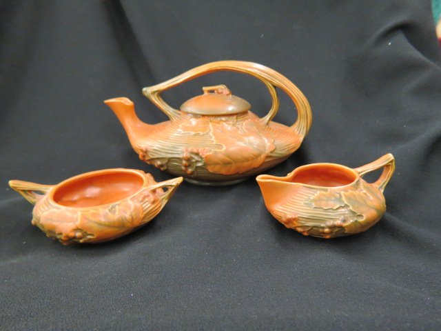 Roseville Pottery "Bushberry" Tea Set,: brown, #2, 1948, teapot is 6", excellent.... The Roseville Pottery Company, founded in 1890 in Roseville, Ohio, started producing simple wares like flower pots, umbrella stands and stoneware. It was n