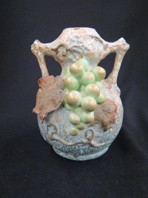 Amphora Pottery Vase,: grape & vine decor, 5 1/2", minor leaf loss...Between 1892 and 1918 the Amphora Pottery Company manufactured thousands of remarkably imaginative and delicately crafted ceramic vessels in its workshop