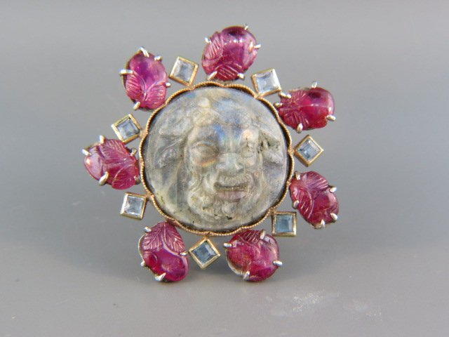 Carved Ruby & Labradorite Carved Cameo Brooch,: or pendant, portrait of a god, 7 carved rubies with square cut aquamarine gems in between, 14k yellow gold with rubies set in silver, 1 5/8" diameter.