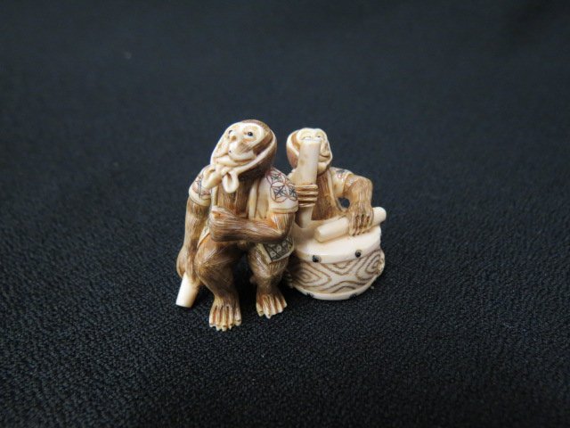 Carved Ivory Netsuke with Two Monkeys: "entertainers", with drum, 2" long, signed, excellent.