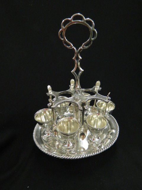 Victorian Silverplate Egg Serving Set,: with 6 egg cups & 6 spoons on fancy holder with center handle, 13 1/2" tall.