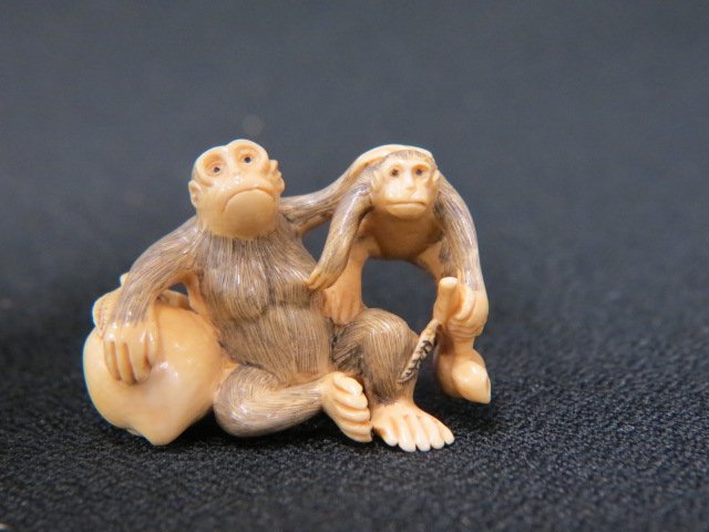 Carved Ivory Netsuke of Two Monkeys: with a large peach, 1 1/2", signed, excellent.