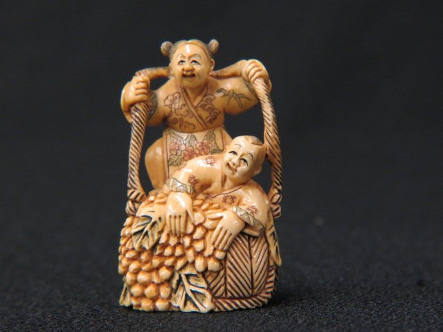 Carved Ivory Netsuke of Young Girl & Boy,: with huge basket of grapes, 2" tall, signed, excellent.