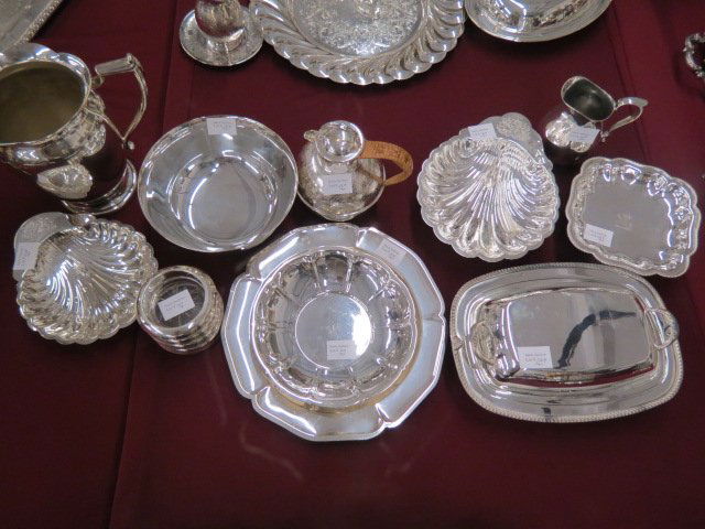 10 pcs. Silverplate Holloware & 4 Sterling: coasters, the holloware includes water pitcher, hot water pot, shell dishes, covered server, bowls, dishes and floralform plate.