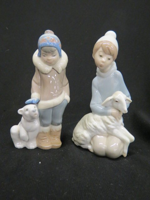2 Lladro Porcelain Figurines,: boy with lamb and boy with polar bear cub, 5 1/2", excellent.