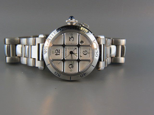 Cartier Man's Wristwatch, Pasha, grid model,: stainless steel, 27 jewel, automatic, view back case, 38 mm...Stainless steel case with removable steel grid and a stainless steel bracelet. Unidirectional rotating stainless steel bezel. White dial w