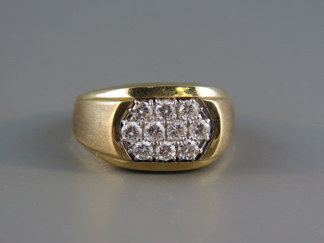 Man's Diamond Ring,: 10 round diamonds totaling 1 carat, high grade, 14k yellow gold, with appraisal of $3150.00 currently size 9 1/4.
