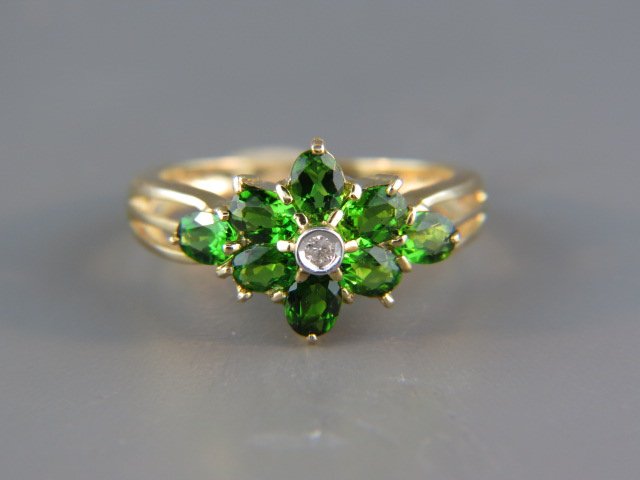 Tsavorite Garnet & Diamond Ring,: 8 rich green gems and a diamond in floral setting, 14k yellow gold, currently size 6 1/4...The shining green tsavorite is a young gemstone with a very long geological history. Its home is the East-Afr