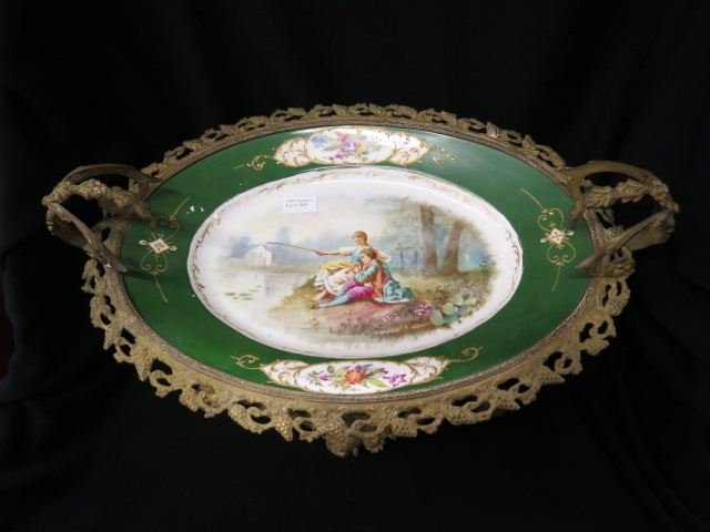 Sevres Porcelain & Ormoulu Centerpiece,: young lovers fishing, green border, elaborate bronze base, 8" tall, 19 1/2" across, 19th century.