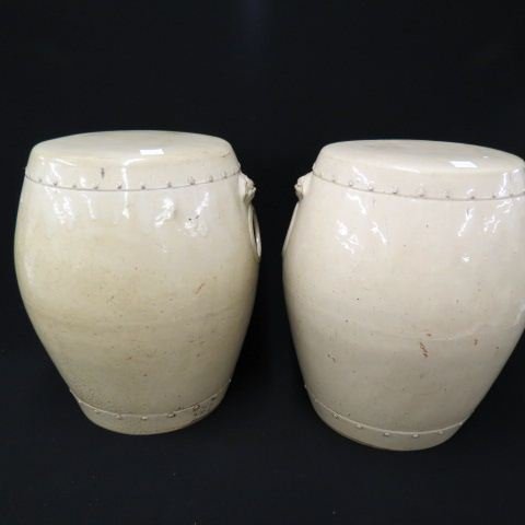 Pair of Early Chinese Pottery Garden Seats,: eggshell color glaze, foo dog head & open ring handles, 18" tall, 17" diameter, (widest point).