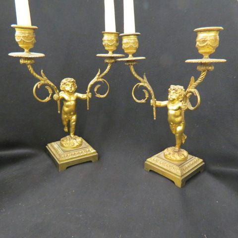 Pair of French Bronze Figural Candleabra,: putti holding sconces, 11" tall, 19th century.