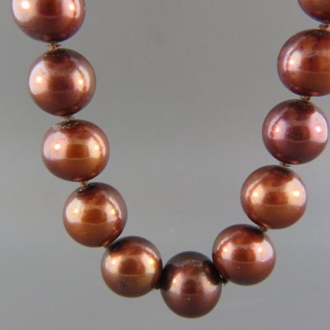 Pearl Necklace,: chocolate colored (dyed) 12 to 33 mm, 14k white gold clasp 18" long.