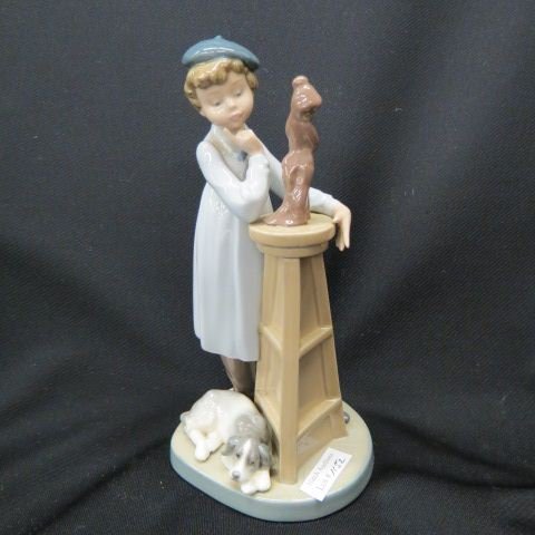 Lladro Porcelain Figurine of Young Sculpture: at work, dog at his feet, 8 1/2", excellent.