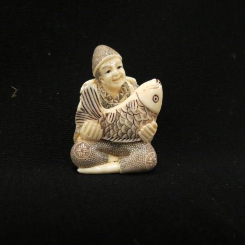 Carved Ivory Netsuke of a Man: with large fish, fancy polychrome, signed, 2 1/8", excellent.