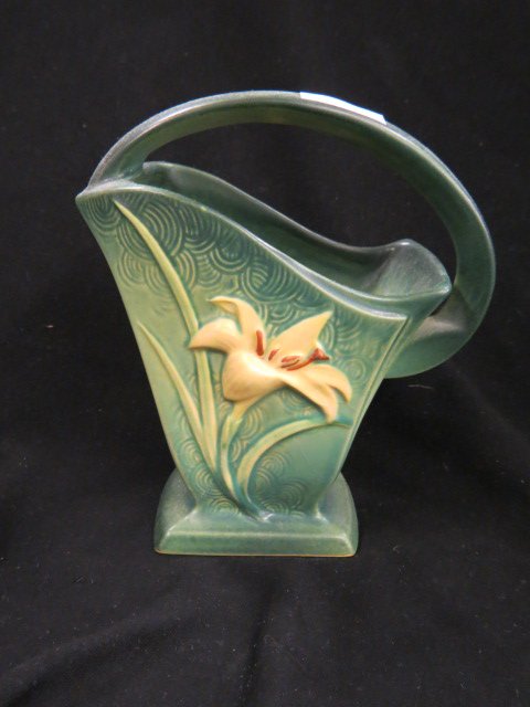 Roseville Zephyr Lily Art Pottery Basket,: green, #394-8, 1946, excellent."....The Roseville Pottery Company was founded in 1890. Roseville initially produced simple utilitarian ware such as flower pots, stoneware, umbrella stands, cuspidors, 