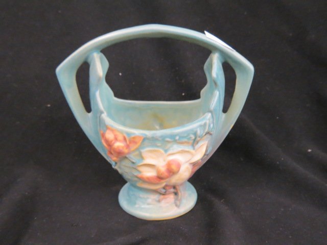 Roseville Magnolia Art Pottery Basket,: blue, #383-7, excellent, 1943."...The Roseville Pottery Company was founded in 1890. Roseville initially produced simple utilitarian ware such as flower pots, stoneware, umbrella stands, cuspidors, an