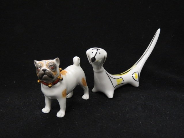 2 Porcelain Dog Figurines,: German pug and Art Moderne dachshund, tallest is 2 1/4."