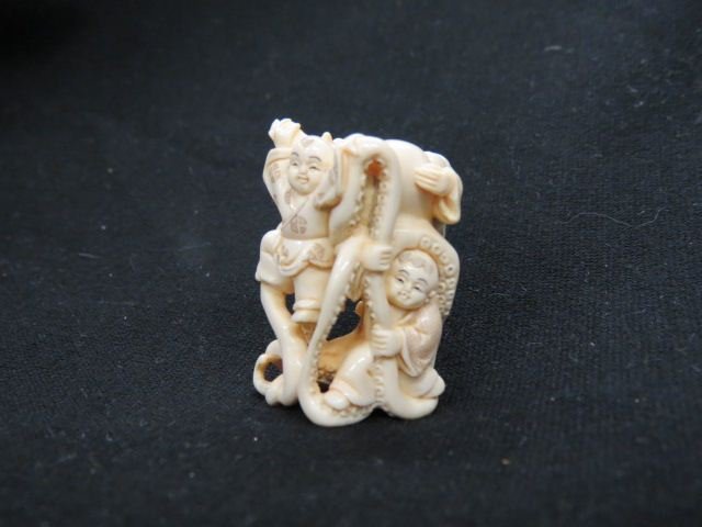Carved Ivory Netsuke of Three Boys: and an octopus, signed, 1 3/4", excellent.