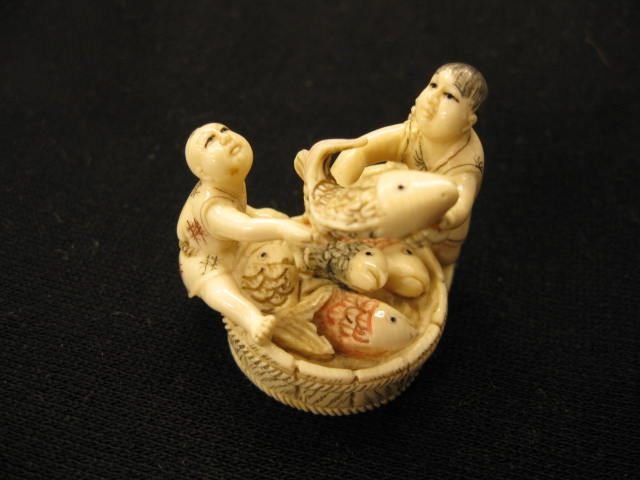 Carved Ivory Netsuke,: man & son with large tub of fish, finely polychromed, 1 1/2", signed, excellent.