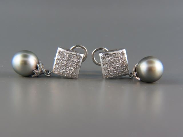 Tahitian Pearl & Diamond Earrings,: silver black 10 mm pearls and 64 round diamonds totaling 1.40 carats in 14k white gold, 1 1/4", post & hinged clip, high grade, with appraisal of $4250.00