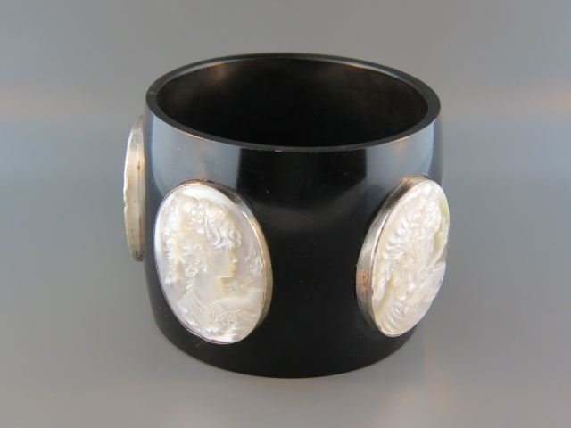 Black Bakelite Style Cameo Bracelet,: bangle, five carved abalone oval portraits of ladies, sterling bezels, 2 7/8" opening, 2 3/8" wide.