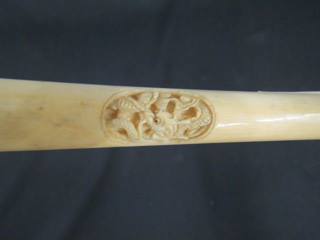 Victorian Carved Ivory Handled Walking Stick,: intaglio dragon, ring & ball at handle, 36 1/2" long, ebonized shaft, buffalo horn end.