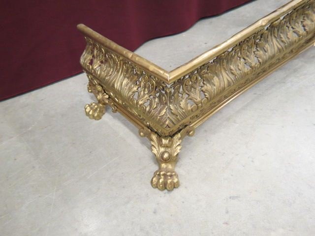 Ornate Victorian Brass Fireplace Fender,: leaf designs with large lion paw feet, 60" wide (foot to foot).
