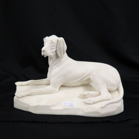 Victorian Parian Bisque Figurine of a Dog,: seated hound, 8" tall, 13" long, stress lines in foot legs otherwise excellent.