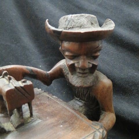 Folk Art Carved Wooden Figurine of an Old Man: at a sewing machine, 8 1/4", excellent.