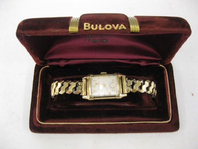 Bulova Man's Wristwatch,: gold-filled rectrangular case, vintage, with original box, working.