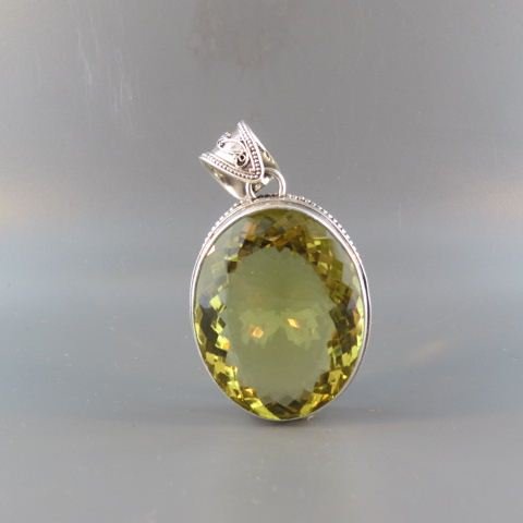 Lemon Citrine Pendant,: huge oval gem weighing over 80 carats in fine sterling silver setting, 1 1/2 x 2"."
