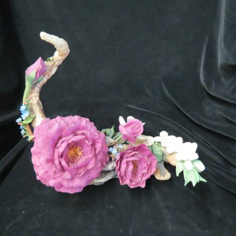 Boehm Porcelain Figurine "The Price Charles Rose: Centerpiece", 12" tall. 14" across, very minor loss... E. M. Boehm, now Boehm Porcelain, is the artisan studio founded by sculptor Edward and wife Helen Boehm in 1950. It is today recognized as one of