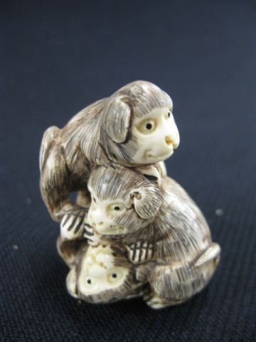 Carved Ivory Netsuke of Three Puppies,: in a pile, signed, 1 3/4, excellent."