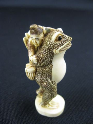 Carved Ivory Netsuke of Gamma Senin: on a huge toad, signed, 2 1/2, excellent."