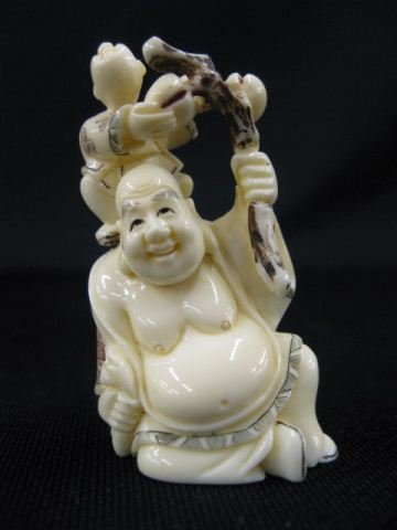 Carved Ivory Netsuke of Hotei,: with child on his shoulders and holding a bunch of peaches, signed, 2 1/2, excellent."