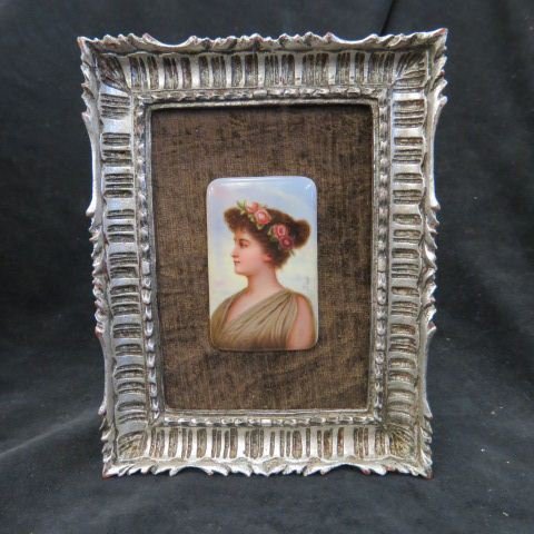 Miniature Painting on Porcelain Plaque,: young lady, flowers in hair, image area 2 1/4 x 3 3/4", circa 1890, in later frame."